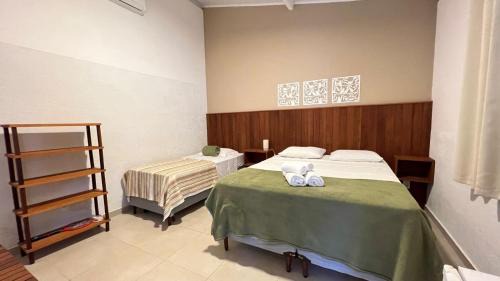 Cumuruxatiba House | Suítes Curió - Passarim Hospedagem