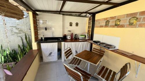 Cumuruxatiba House | Suítes Curió - Passarim Hospedagem