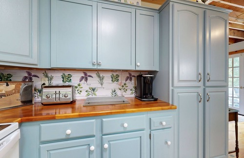 Warren House | Sunny, lakefront home on South Pond with private dock, great deck & firepit