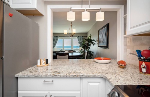 Caswell Beach Condo | Swept Away: Modern Oceanfront Condo Steps from Community Pool