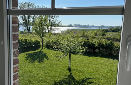 Poseritz House | Thatched house with stunning water views on the edge of a nature reserve in a peripheral location