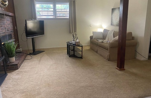 Auburndale House | The basement space nestled in a charming neighborhood and close to all amenities