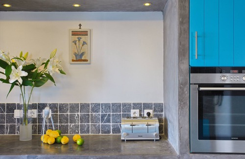 Santorini Villa | The Dome House: stunning sea views, garden, pond and squash court