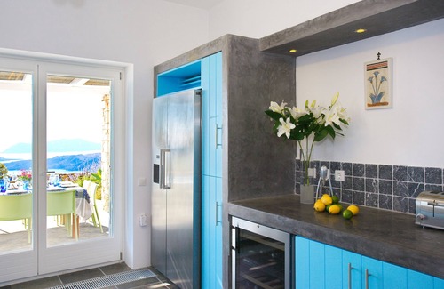 Santorini Villa | The Dome House: stunning sea views, garden, pond and squash court