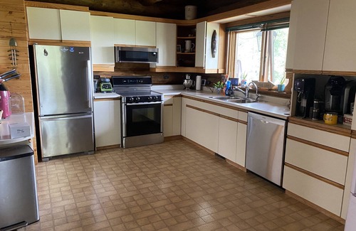 East Central Saskatchewan House | The Lodge-Unique log home on the banks of the river