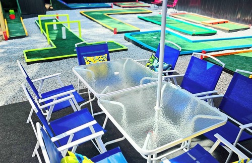 Columbus House | The Mini Golf Oasis king beds & Movie/Game room minutes to Fort Benning GA.