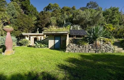 Pigeon Bay Apartment | The Mud House— earth studio in Pigeon Bay with views, wood-fired sauna & bath!