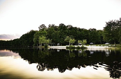 Reeders Cabin | This lovely farmhouse is set back in the woods, just a short walk from the lake