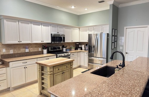 Sunset Pointe House | TikiTiki Lake Sumter, private pool, hot tub, game room, outdoor kitchen&tiki bar