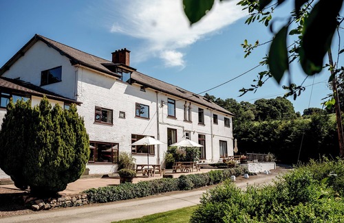 Howey House | Tranquil countryside retreat with stunning views, gardens, and private lake.