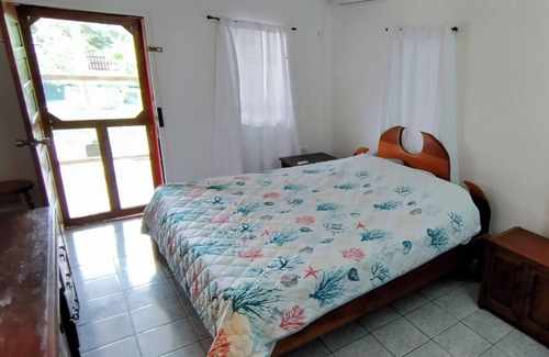 Placencia Condo | Tranquil Village Retreat. New A/C! Steps from the Beach. Pet Friendly & Parking!