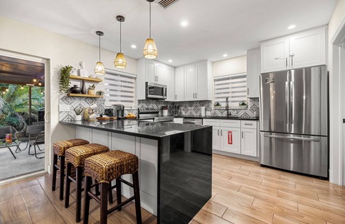 Edgewood House | Tropical Getaway + Heated Pool, Arcades–5 MIN to The Fort: Pickleball - Sleeps 8