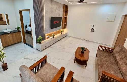 Tirupati Apartment | TrueLife Summit Suites - Premium stay near Tirupati temples - Breakfast included - Spacious AC apartments with in suite bathrooms - 55" Android TV, 250 Airtel channels, Super fast WiFi - Hall, Modular kitchen, Dining, RO system, Parking - Top service