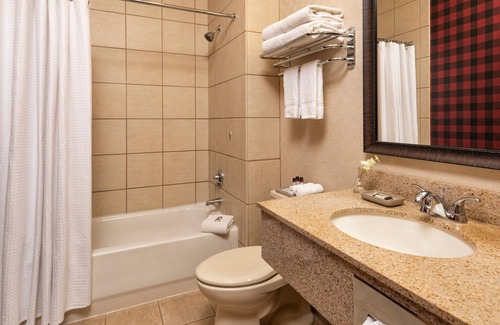 Rothschild Hotel | Two Queen Fireplace Suite With Kitchen, Access to Pool, Hot Tub, and Gym