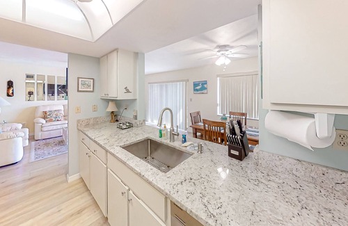 Pine Island Center House | Two-story townhouse with a sunroom, heated pool, hot tub, & tennis courts