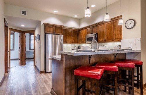 Woodwinds House | Updated Woodwinds Townhome! Walk to the Village! 2 Car Garage! 2 Decks!