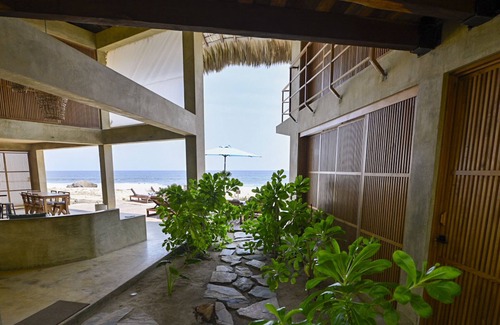 Santa Maria Tonameca Villa | UtopiAmar Las Palmas: a design beach room in a spectacular front beach setting.