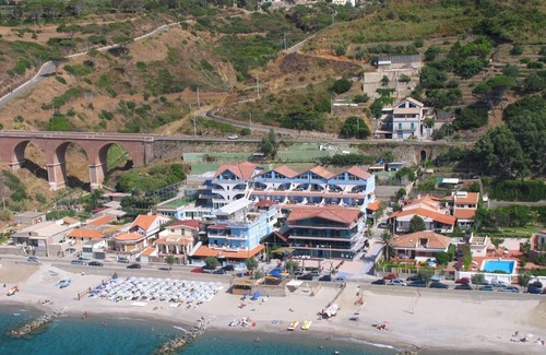 Province of Messina House | Vacation Home "Oasi Azzurra - Bilocale Plus 2" with Sea View, Shared Pool & Shared Terraces