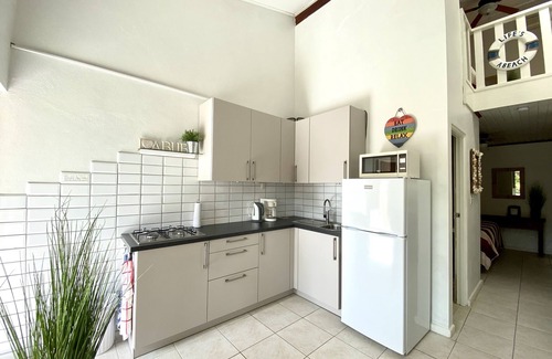 Camacuri Apartment | Vacation home with hotel service in sunny garden with pool, close to beach