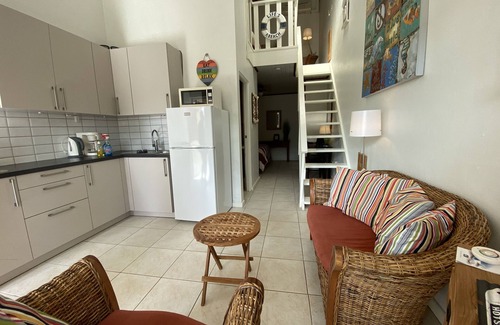 Camacuri Apartment | Vacation home with hotel service in sunny garden with pool, close to beach