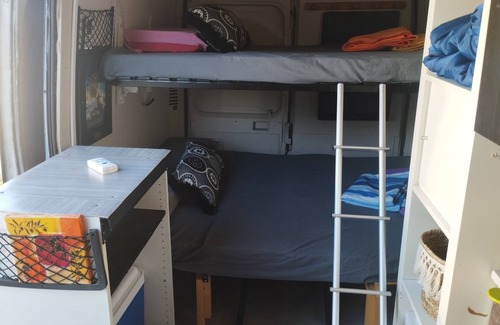 Millenaire House | Van set up in a PUBLIC parking lot that's good for repairs