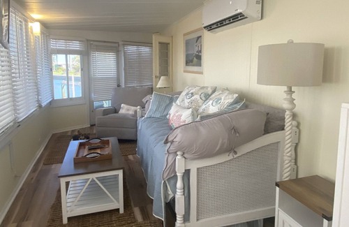 Nettles Island Cottage | Vintage cozy beach house waterfront on grand canal with dock