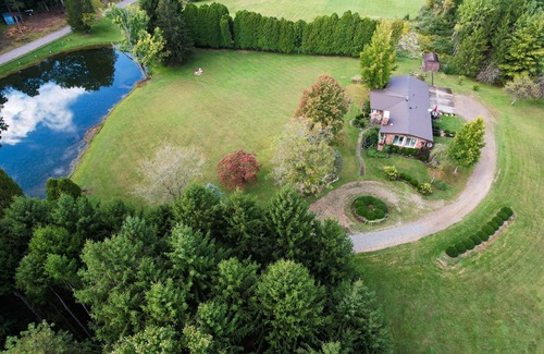 Ava House | We are a quiet ranch home that sits on 8 acres with firepit, pond and bar.