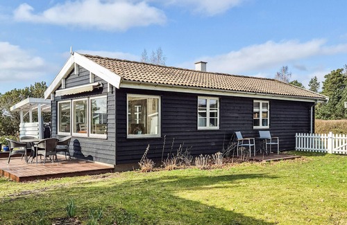 Skibby House | Welcome to this cozy wooden holiday home for a wonderful vacation.