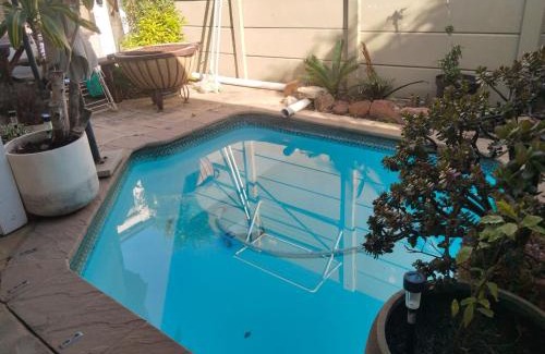 Plumstead House | Wembley Home -Heated pool, indoor braai, jacuzzi come relax