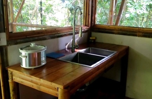 Ballena Cabin | Yogachal Vista Mar bamboo cabiña in jungle w waterfall and seaview yoga deck