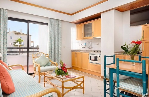 Areias de Sao Joao Hotel | Your Home Away From Home! Full Kitchen, Free Parking, 2 Pools, Near Oura Beach!
