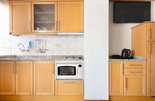 Areias de Sao Joao Hotel | Your Home Away From Home! Full Kitchen, Free Parking, 2 Pools, Near Oura Beach!