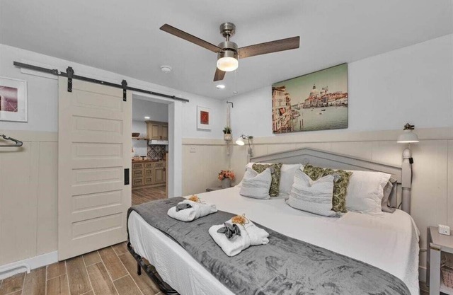 1 bedroom, 1 bathroom sleeps max 4 guests with the sleeping arrangements being a king bed and futon that sleeps 2