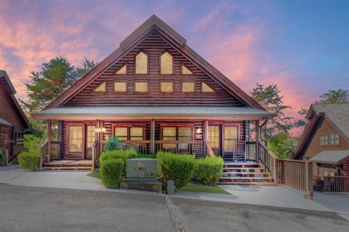 2 Miles from Dollywood Family Resort with Seasonal Outdoor Swimming Pool, Year around Heated Indoor Swimming Pool, Townhome Style Cabin, Private Hot Tub, Arcade, TV, Wifi, Kitchen with Refrigerator, Washer and Dryer