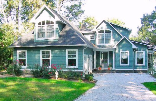 A huge deck and screen porch on this contemporary cape in Edgewater offers great views of Beard's Creek and out onto the South River.