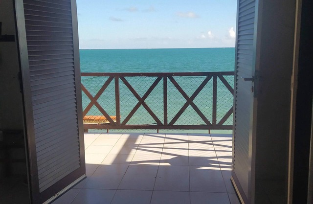 A private chale less than 20 feet from the ocean