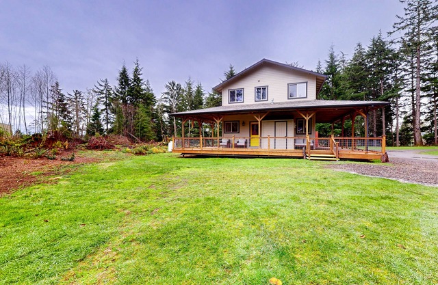 Coastal acreage with wrap-around deck & furnished patio - great location