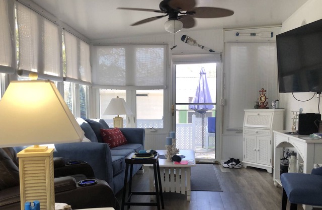 Cool beach retreat with large porch for those looking to unwind.