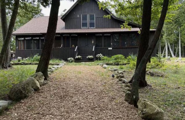 Cozy Lake Home Located on Marquette Island Surrounded by Water Beautiful Sunsets