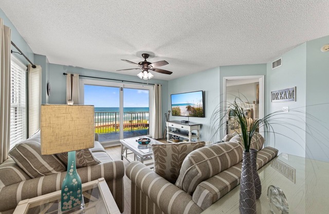 Direct oceanfront corner condo with large balcony, beachfront pool, and garage parking