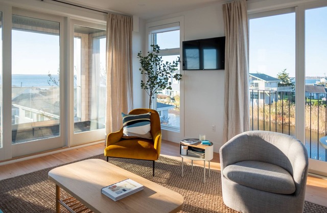 Enjoy 180 degree views of the Vineyard Sound from this new modern beach house!