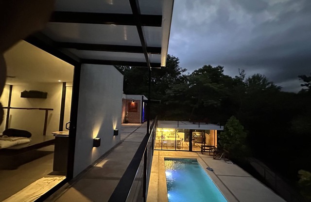 Enjoy privacy and nature in this open concept home and relaxing pool. n