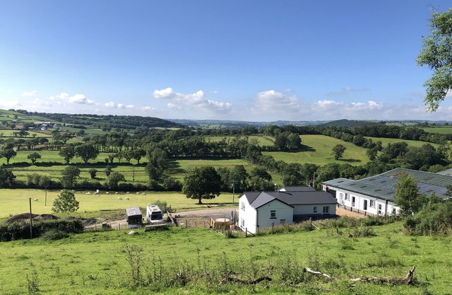 Farm setting with large living areas and wood fired hot tub
