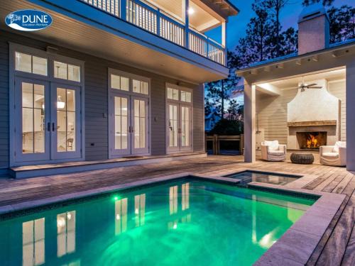 'Here Comes the Sun' has a Private Pool, 6 Seat Golf Cart, and Stunning Outdoor Living Space home