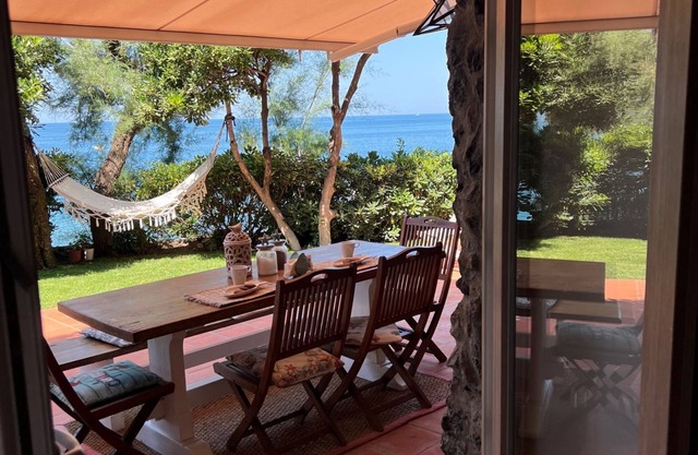 House by the sea with equipped terraces, direct access to the sea