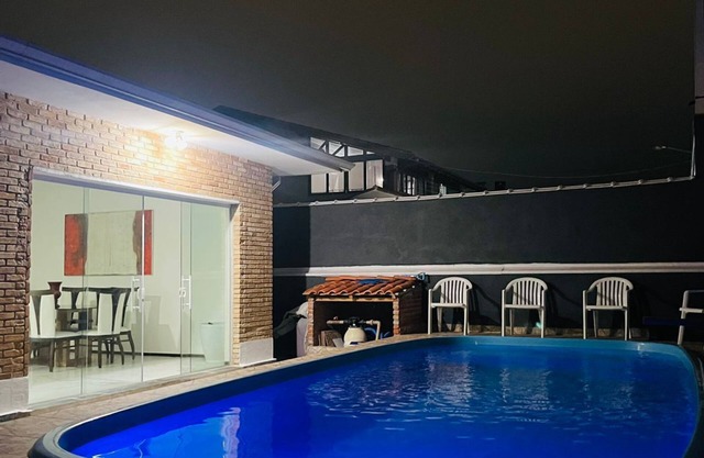 House in the center with swimming pool