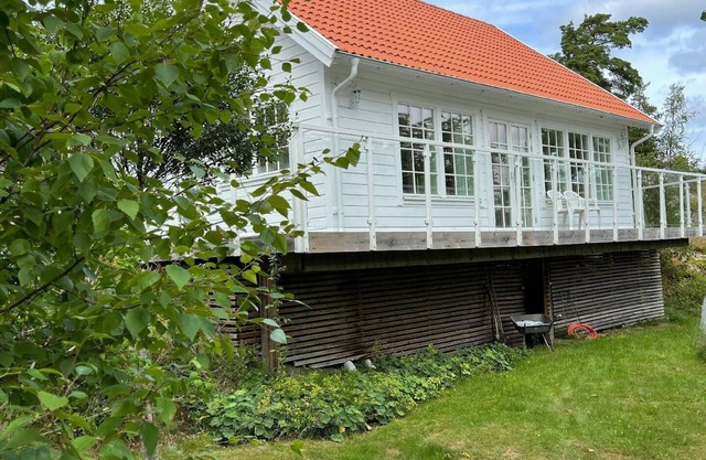 House with a light interior, on a little island