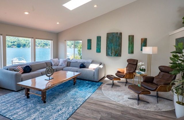 Inviting lakefront home with hot tub, game room, dock, kayaks, pool table, & W/D