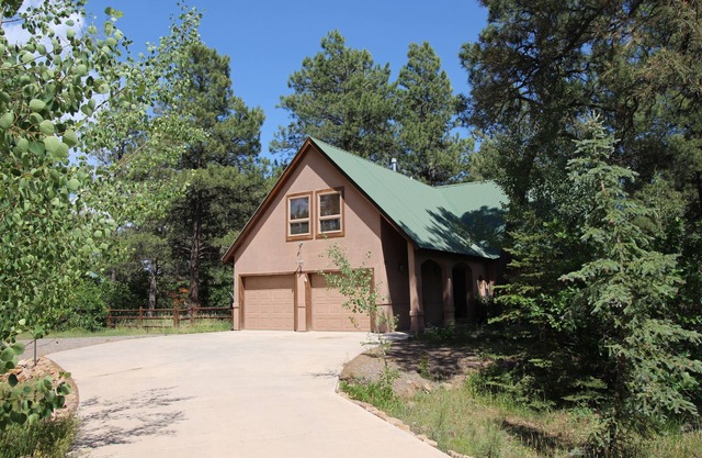 Large Family Friendly home in quiet forested neighborhood with sauna & hot tub.