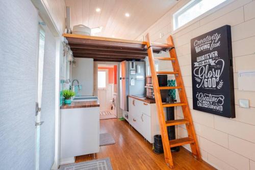 Lofted Bedroom Teal Tiny Home with Creek Views